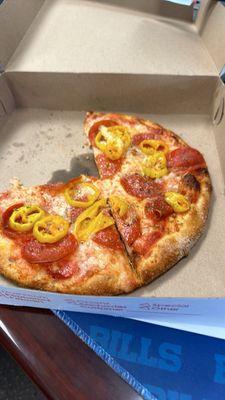 Personal pizza with pepperoni and banana peppers