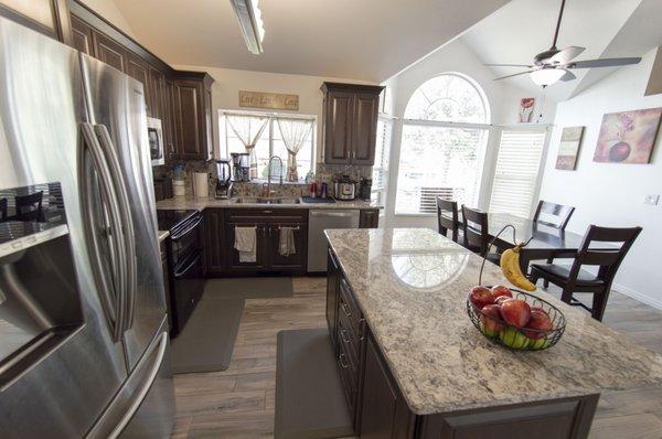Full kitchen remodel including new cabinets, tile, appliances, countertops, lighting, and more.