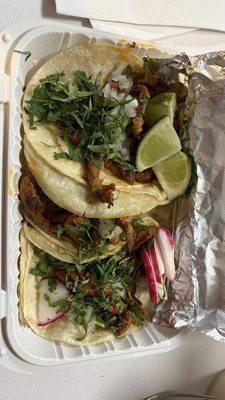 Al Pastor tacos with cilantro, onion, lime, and radish on corn tortillas - combo #2 comes with house fried chips and a beverage