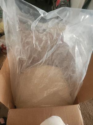 Quinoa packed in non food safe plastic bag that was zip tied and not properly sealed.