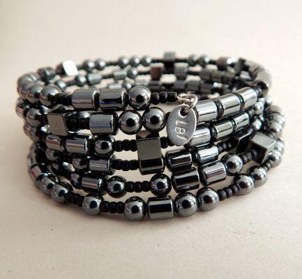 Morse Code cuff bracelet. The beads spell out "What is it you plan to do with your one wild and precious life?"