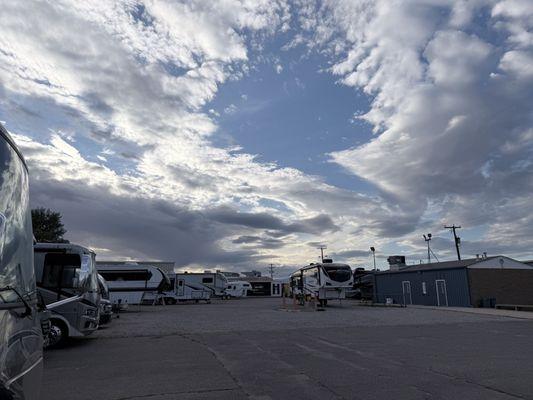 The fiberglass Worx rv repair center parking lot, showing outside and rvs parked to get repaired