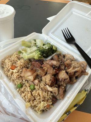 Bourbon chicken with fried rice and veggies.