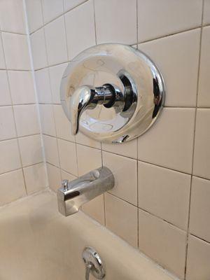 Tub/shower faucet replacement from three handle to single handle without tile work being necessary.