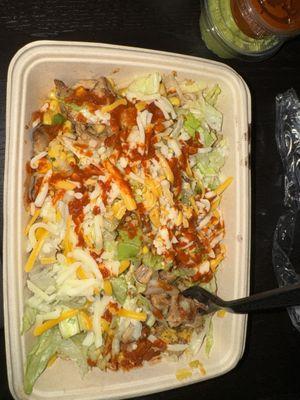 chicken, yellow rice, black beans, lettuce, corn salsa, and cheese