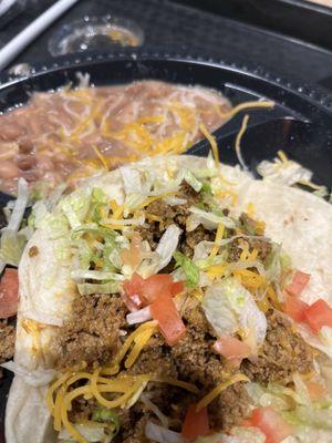 One of the tacos and the beans I tried and then left alone.