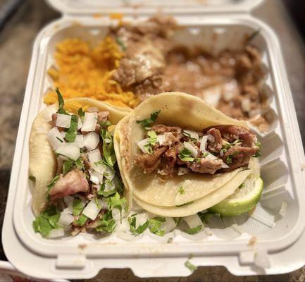 The taco plate half eaten.