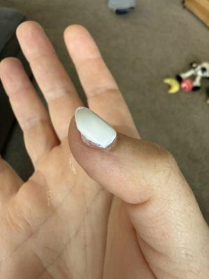 Natural nail underneath is visible