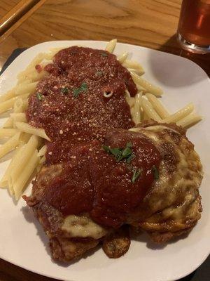 Chicken Parmigiana with a side of pasta in red sauce