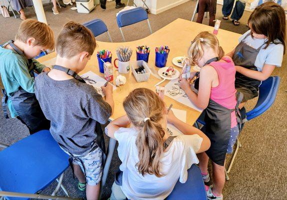 Children drawing during an art classes at Blue Mouse Gallery