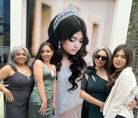 My guests taking pictures in front of her picture