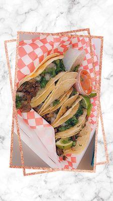 My four tacos de carne asada with their delicious salsa's.