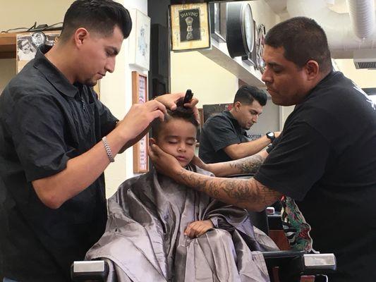 My son falling sleep when he was lil! Adrain has a magic touch with kids! This was when he used to get comb over.