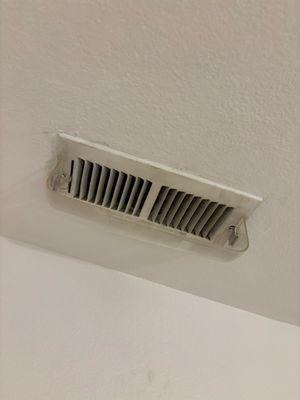 The register that was damaged during my duct cleaning (shown repaired)