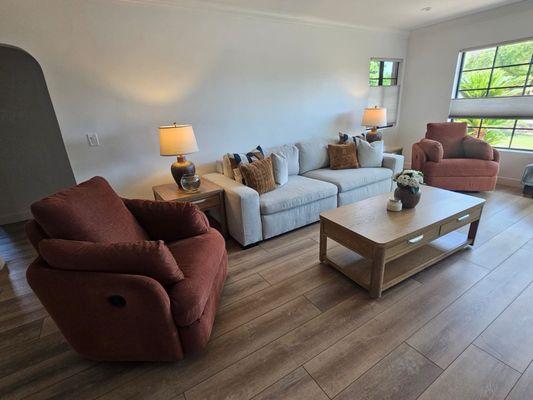 Awesome slider sofa with pet friendly fabric. With accent recliners and beautiful earth toned coffee tables.