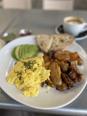 Homestyle Breakfast and a Cappuccino. Don't sleep on the (hot) green sauce!