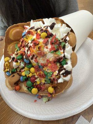 Bubble Waffle with Vanilla Ice Cream, M&Ms, whipped cream and fruity pebbles