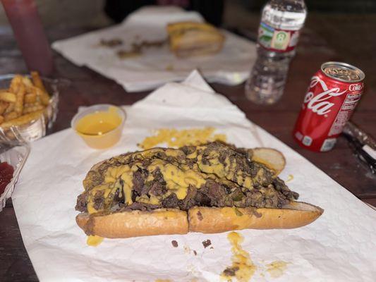 Philly Cheesesteak with cheese whiz, onions, mushrooms, peppers and extra cheese whiz (big back alert!)