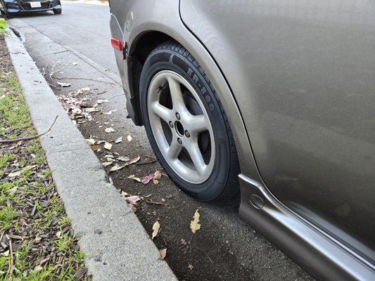 Rear right tire and passenger door. Looks like it just came out of the show room floor