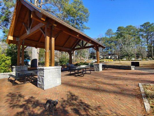 Nice picnic table area with electric outlets and ceiling fans.