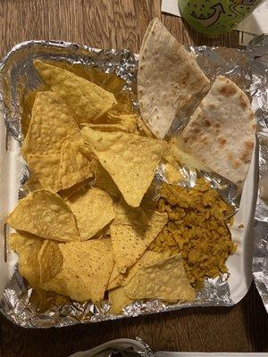 Nice, filling kids meal of approximately three bites of a quesadilla and an assload of stale tortilla chips. $8. Bye.