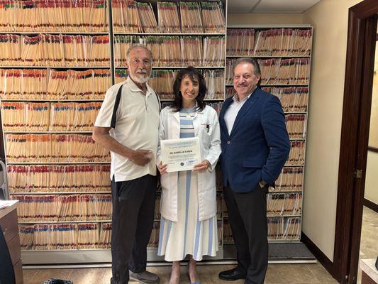 Recognition Award  to Doctor Isabela Ilarda.  James Turano left, Dr, Ilarda, Middle and Senator Joseph Addabbo Jr.