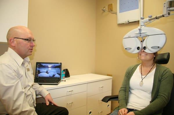 Dr. Paul Damlo and patient during an eye exam.
