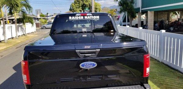 Rear angle.zoom in and see how the tonneau cover follows contour of tailgate. Super cool design.
