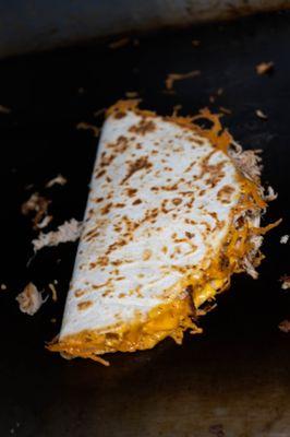 Chicken quesadilla, served with garlic parm or BBQ sauce for dipping