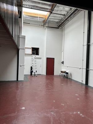 Original red painted floor with moisture damage.