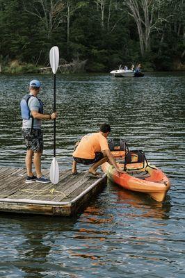 Getting a kayak ready for a customer.