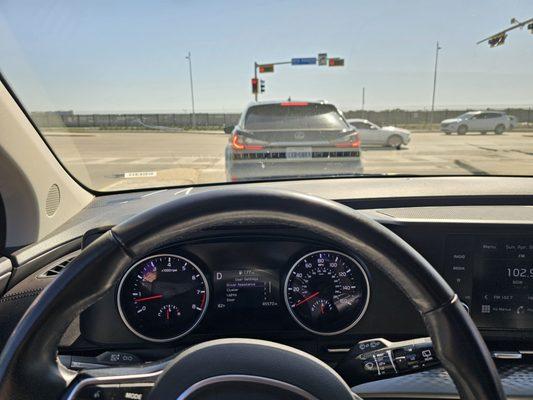 When I left the lot. That's the fence that runs along the airport as you enter Love Field. Mileage is 45572 (177 mile range).