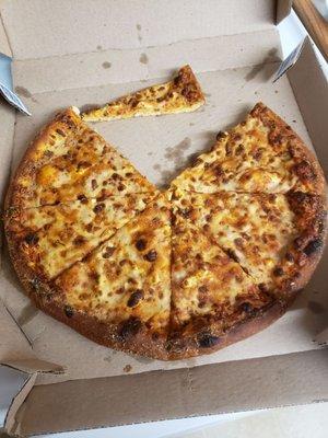 This pizza was burnt, hard and dry.