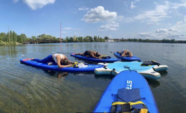 A pause in Pigeon pose during SUP Yoga on Boardman lake this past summer.