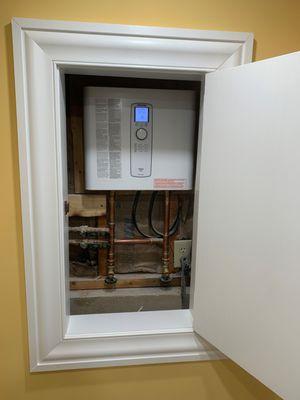 An electric tankless water heater that produces up to 4.8 gallons per minute of hot water. The unit was framed in and is easily concealable.