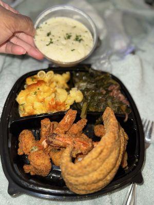 Shrimp and Fish with a side of grits, greens, mac&cheese.