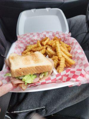 Club house sandwich with golden fries!