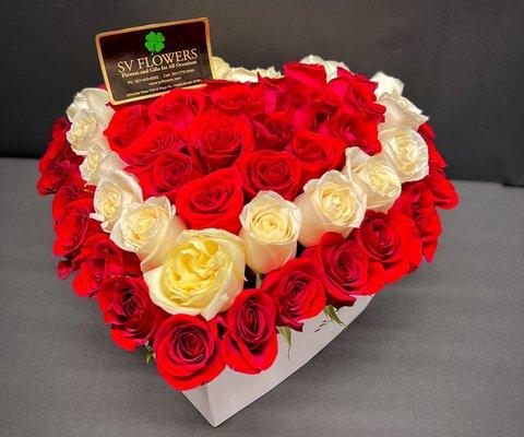 Heart box arrangement with white and red roses.