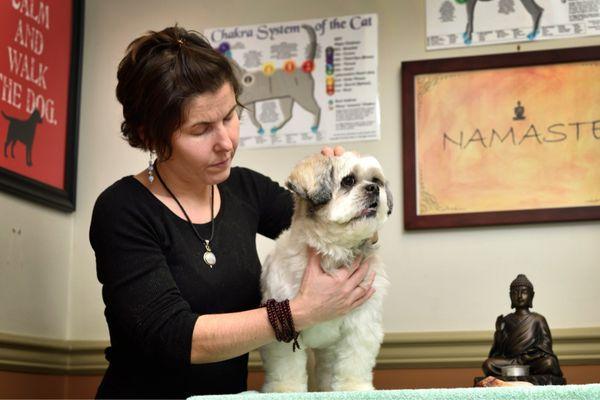 Erica offers healing energy to a friend in need