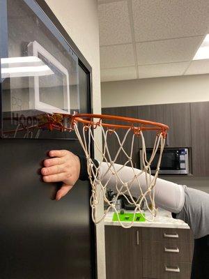 Look at this trailer park game, a basketball rim with Twix bars holding it together.