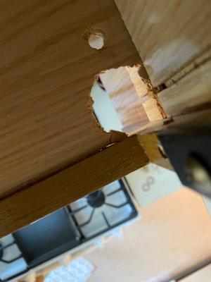 Damage created in bottom of cupboard.