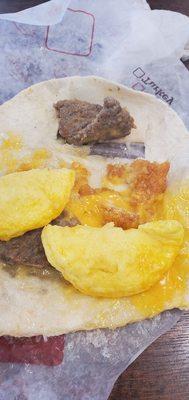 This is a wrap that has no hash brown but a little piece and the wrap got stuck to the paper rip everything apart