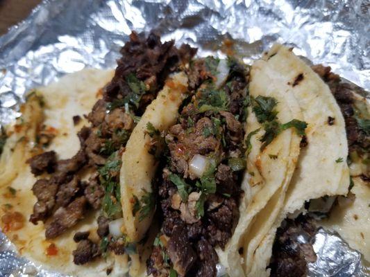 Nasty, crispy, old, rancid, oily carne asada that I didn't even ask for. Look for yourself at the taco furthest to the left. Disgusting