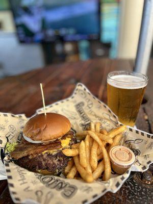 Deluxe burger with bacon and fries
