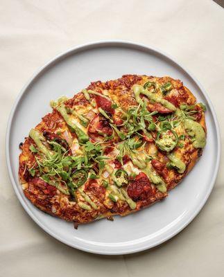 Butter chicken flatbread - Spiced chicken, red onions, bell peppers, jalapeños, and rich mozzarella bring the warmth of India in every bite