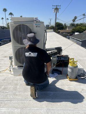 One Hour Heating and Air technician performing a leak test in Anaheim, California