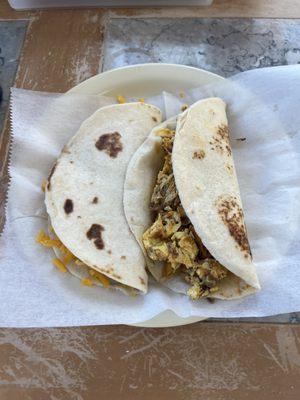 Bean and cheese taco and chorizo and egg taco