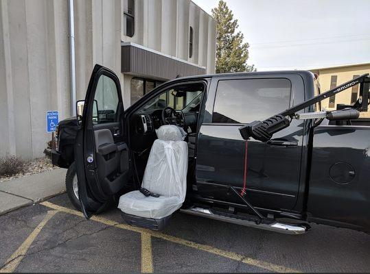 Driver side Turny Seat in new truck with wheelchair lift in bed.