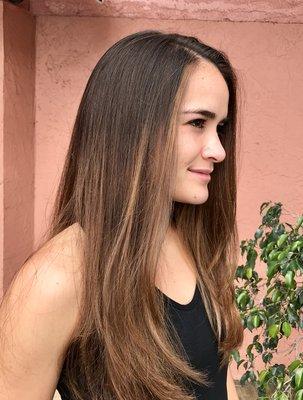 Balayage on brown hair for a softer lighter low maintenance look.