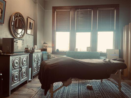 Light in the massage studio is adjusted for a calming massage experience.